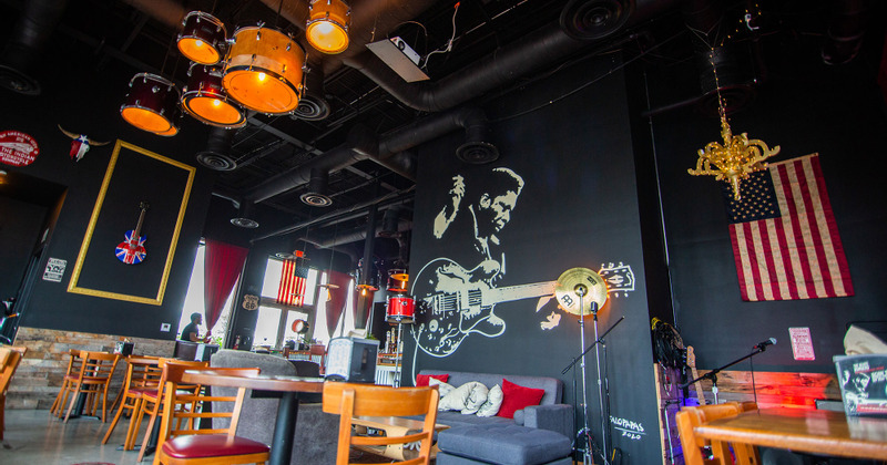 Interior, graffiti of a guitar player on the wall