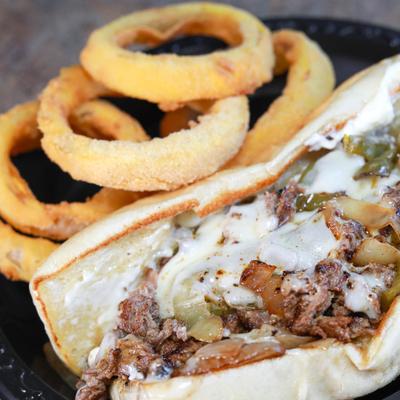 Philly Cheesesteak and onion rings.