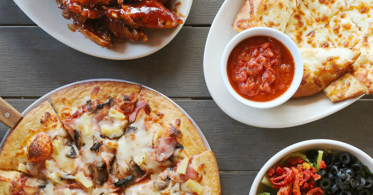 A served pizza and other meals