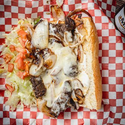 Po Boy wit meat, cheese, onions and side of salad.