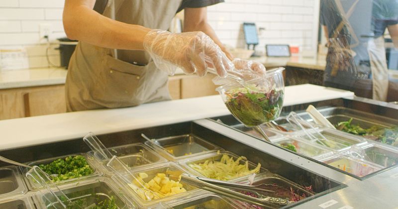 Employee packing food for take out