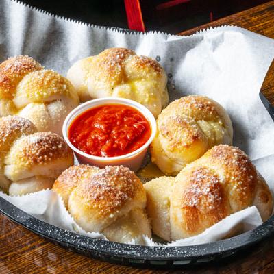 Garlic Knots served with marinara sauce.