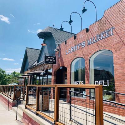 Exterior, front entrance and fenced seating area.