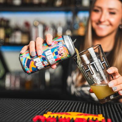 Bartender pouring a glass of Hazy IPA.