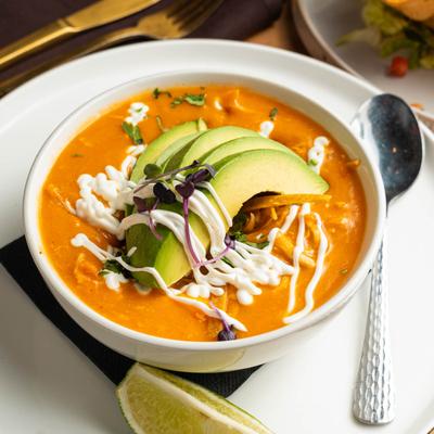 Tortilla soup with avocado.