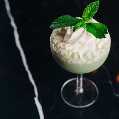 Grasshopper cocktail topped with vanilla gelato.