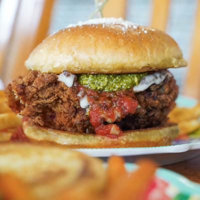 Chicken Parmesan Sandwich with fries close-up.
