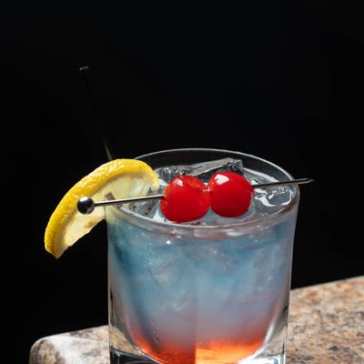 A cocktail with cherries.