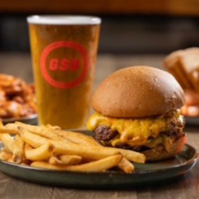 burger fries and glass of beer.