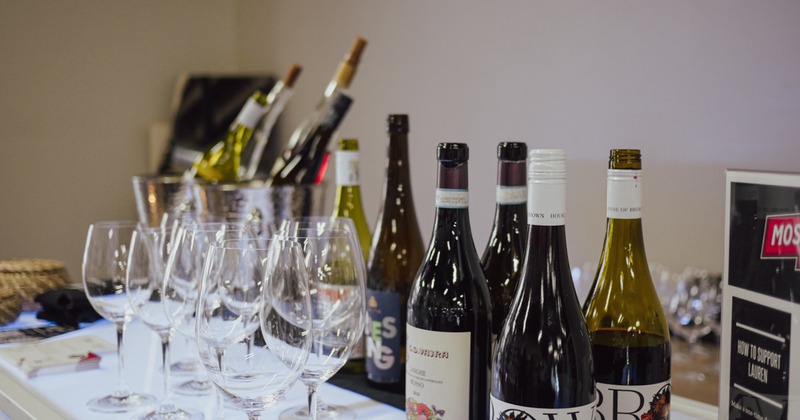 Table with glasses and bottles of wine