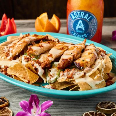 Nachos with grilled chicken,  chorizo, grilled onions, and fresh jalapenos.