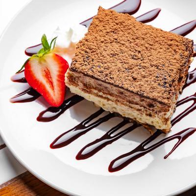 Tiramisu topped with  semisweet cocoa powder.