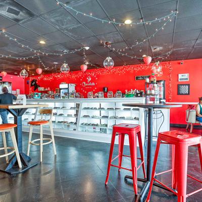 Interior, seating area, bar tables and stools.