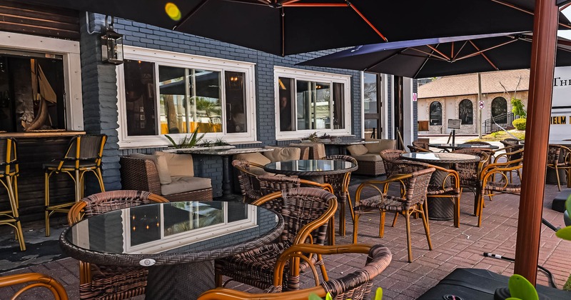 Exterior, patio with tables and chairs