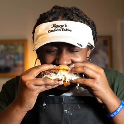 Customer eating a burger.