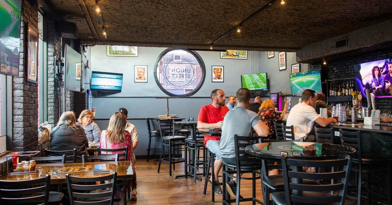 Interior, guests sitting in the bar area