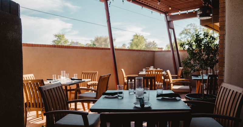 Set tables and seating inside and on a terrace