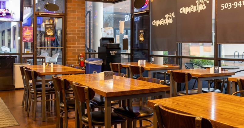 Interior seating area with wooden chairs and tables
