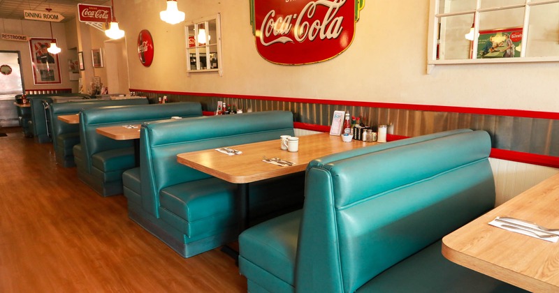 Interior area with seating booths and decorations on the walls