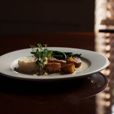 Seared scallops, green beans, and mashed potatoes.
