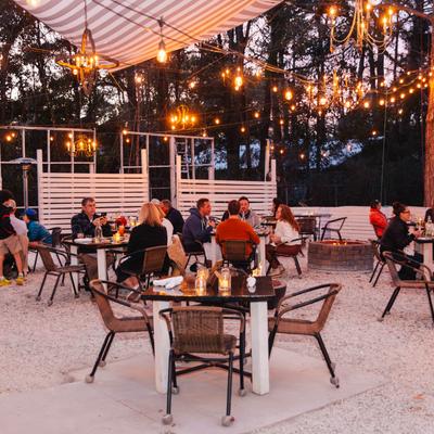 Exterior, covered patio, seating area, customers dining.