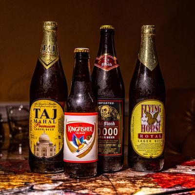 Section of Indian beer in the bottles displayed on the table.