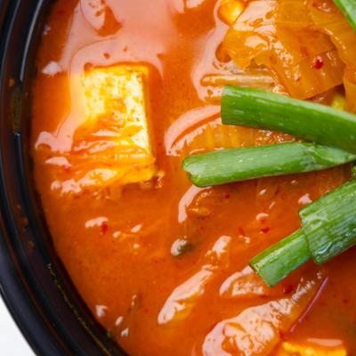 Close up of a bowl of spicy cold mixed noodle dish.
