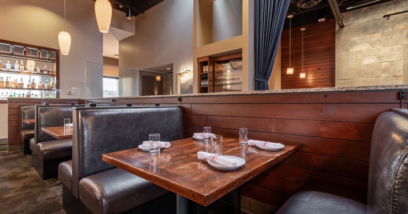 Interior, seating area with boots and tables