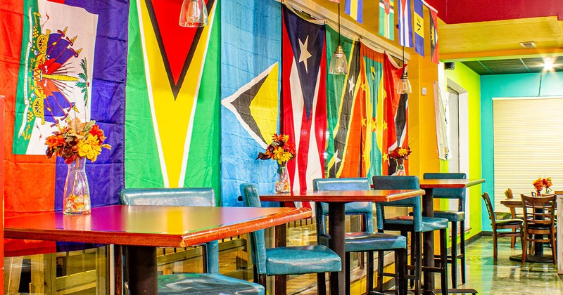 Interior space, flags behind bar tables and stools