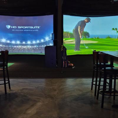 Virtual golf and baseball on screens.