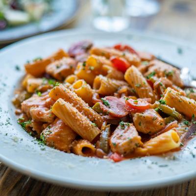 Rigatoni with chicken, mushrooms, Parmesan, cherry peppers, and marinara sauce.