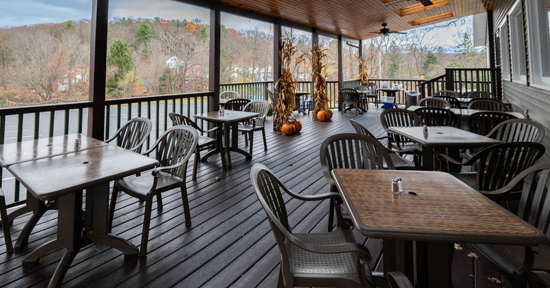 Outdoor, covered patio with tables and chairs