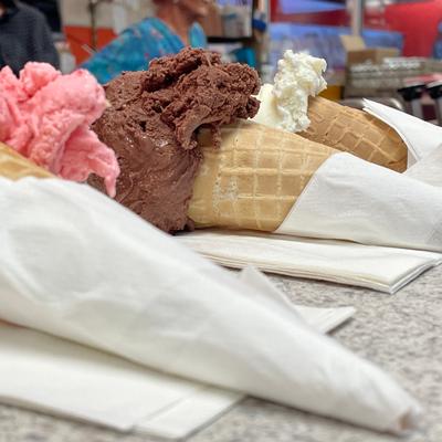ice cream cones lined up to be delivered to customers.