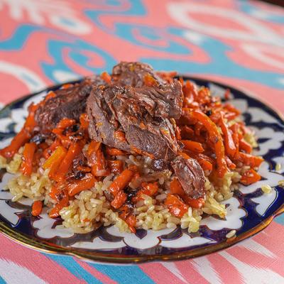 Uzbek Pilaf, with layered rice, carrots, and beef.