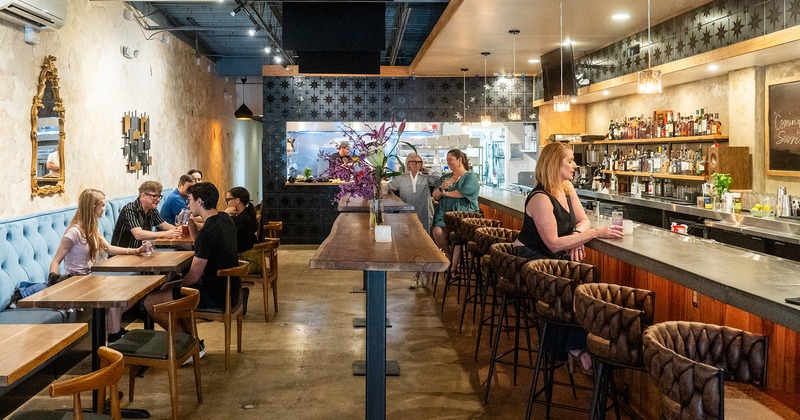 Modern style of interior design, guests chatting and enjoying their drinks