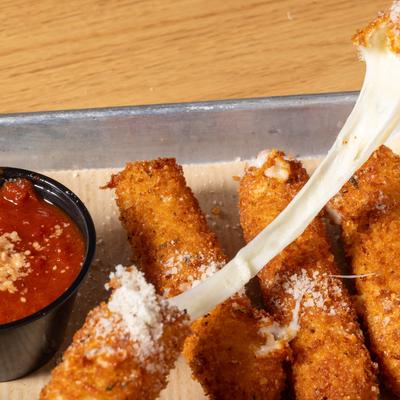 Mozzarella sticks, cheese pull shot.