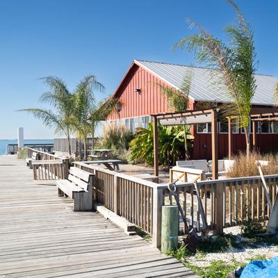 A wooden dock with the restaurant.