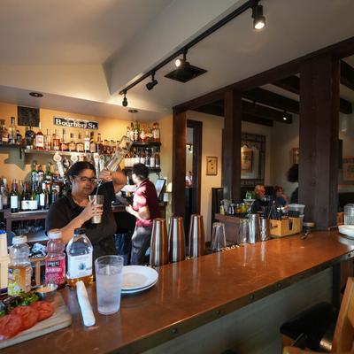 A person behind the bar.