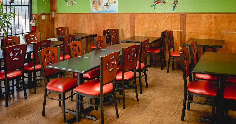 Interior, lined up dining tables and chairs