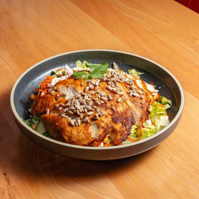 A chicken salad with a variety of ingredients.