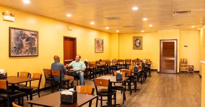 Interior, diner area, tables, chairs, people seating