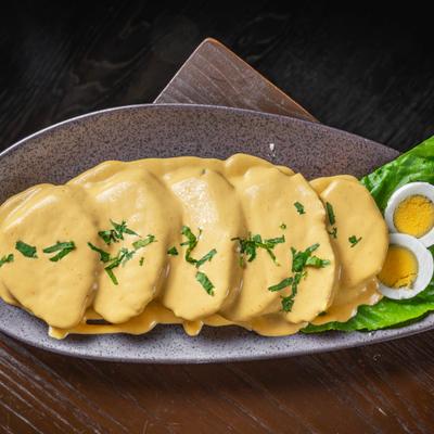 Boiled potatoes smothered in melted cheese.