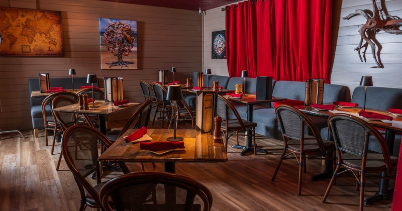 Interior, dining tables and chairs, decoration on the walls