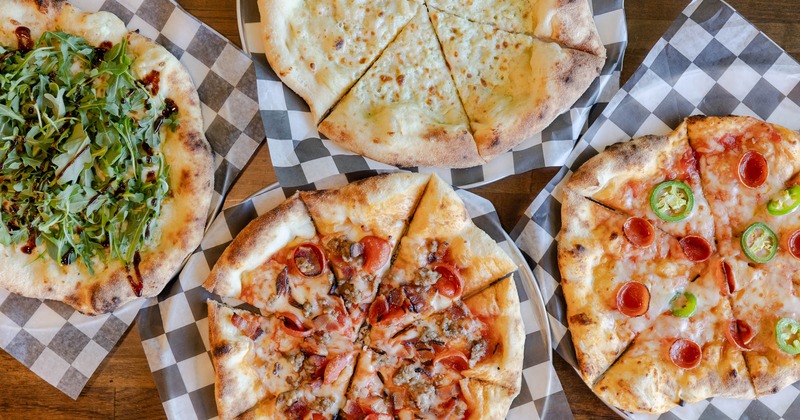 Top-down view of assorted pizzas