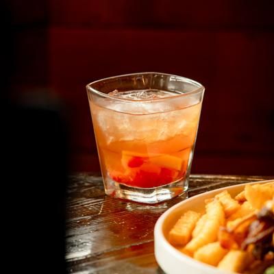 A served meal with the Old Fashioned cocktail.