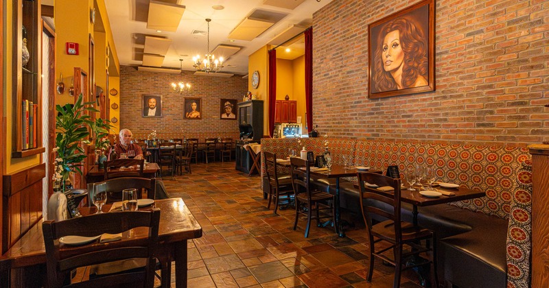 Interior, dining area, tables for two, long corner banquette bench with tables and chairs