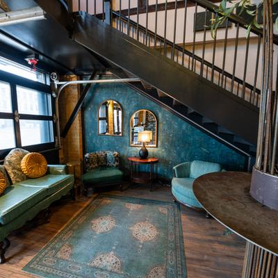 Lounge seating under a staircase.