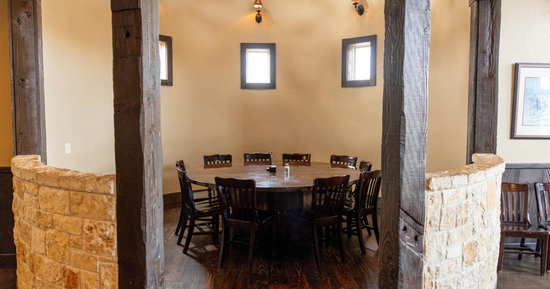 Interior, private dining room, round wooden table for ten people, wooden flooring