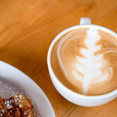 Corn flake french toast and latte, close up.