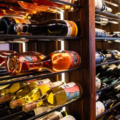 wine rack at georgian restaurant featuring several bottles of wine